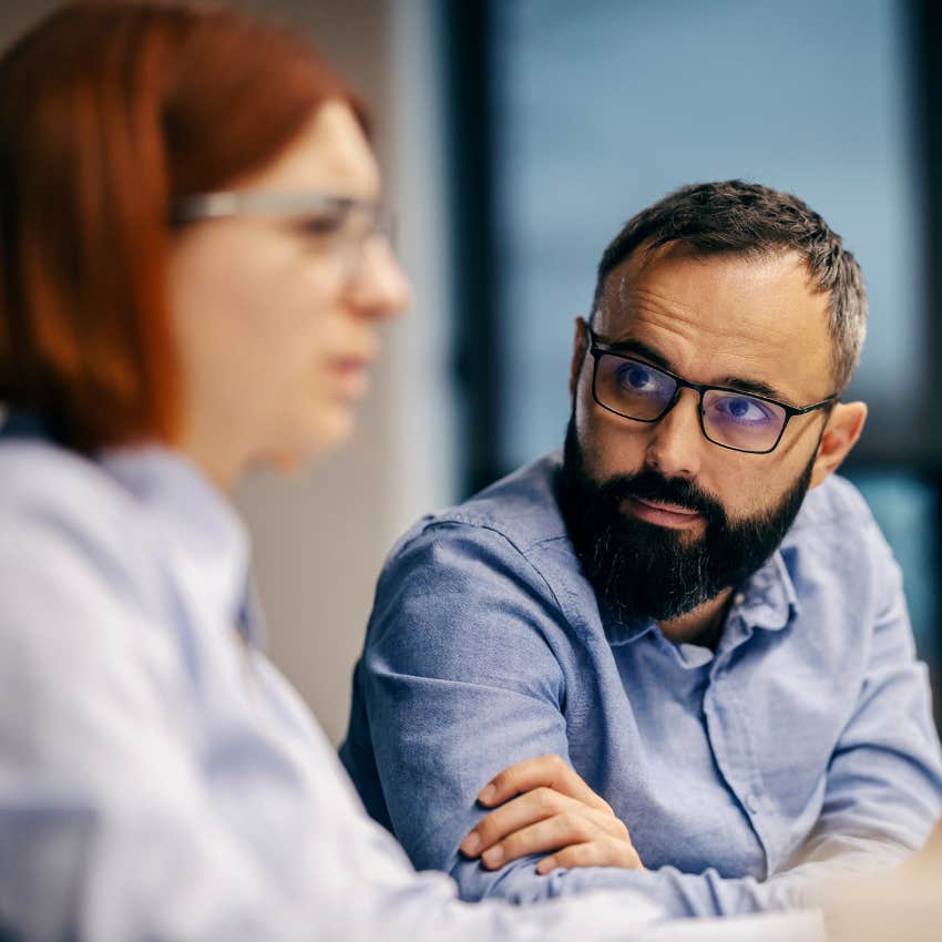 man becoming quiet after intimidating woman walked in
