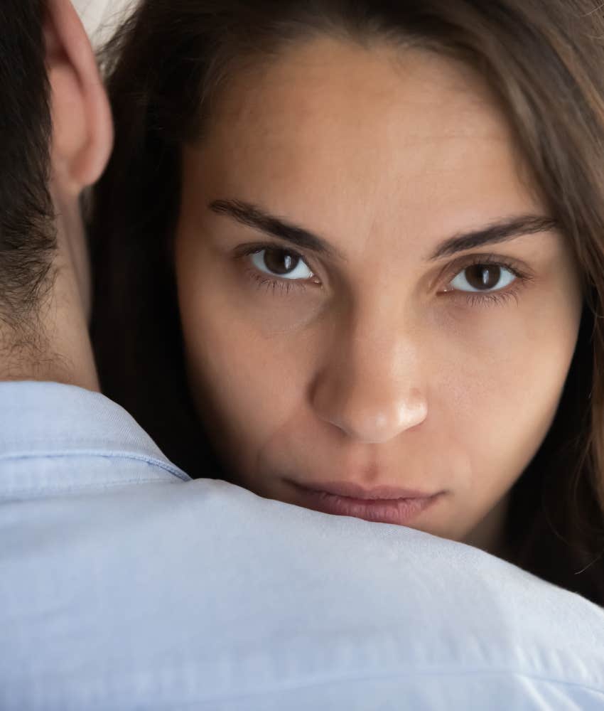 Overly serious person hides feelings to hug partner showing reason for attracting bad people