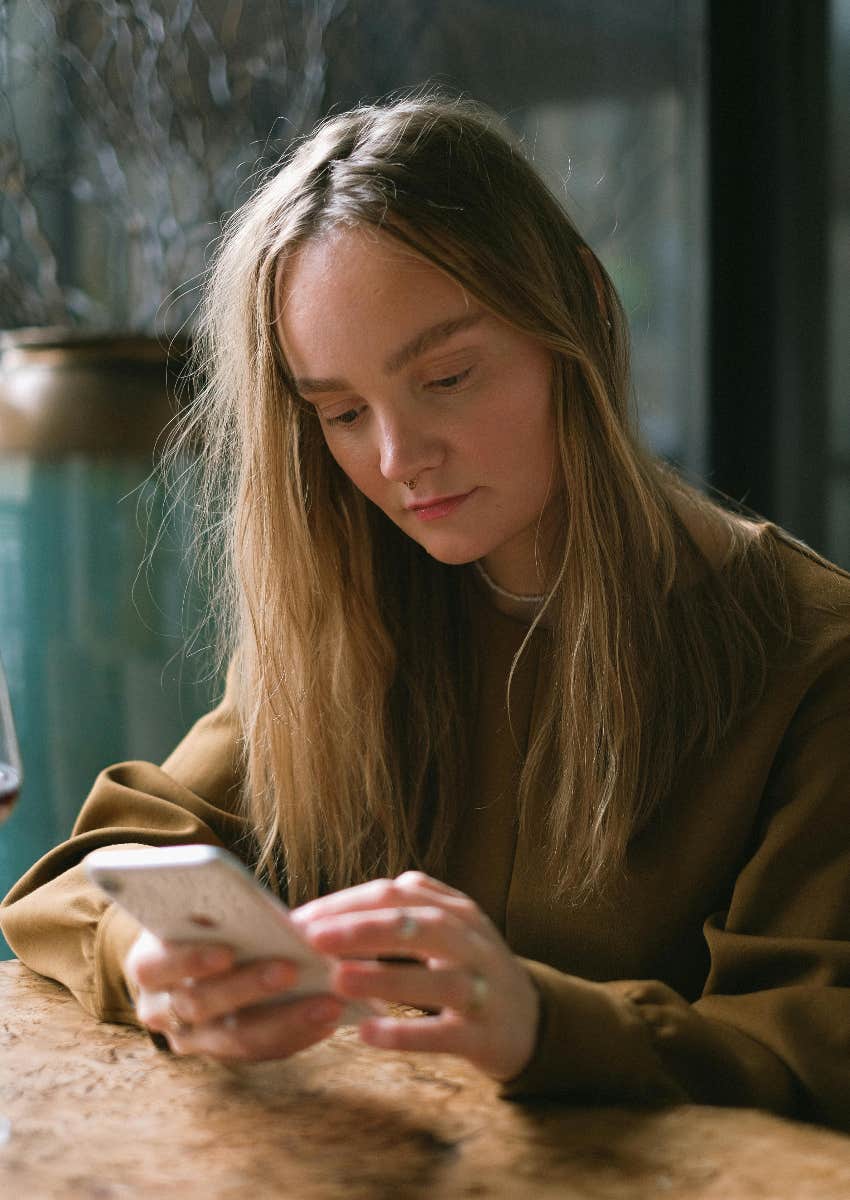 young woman scrolling on her phone