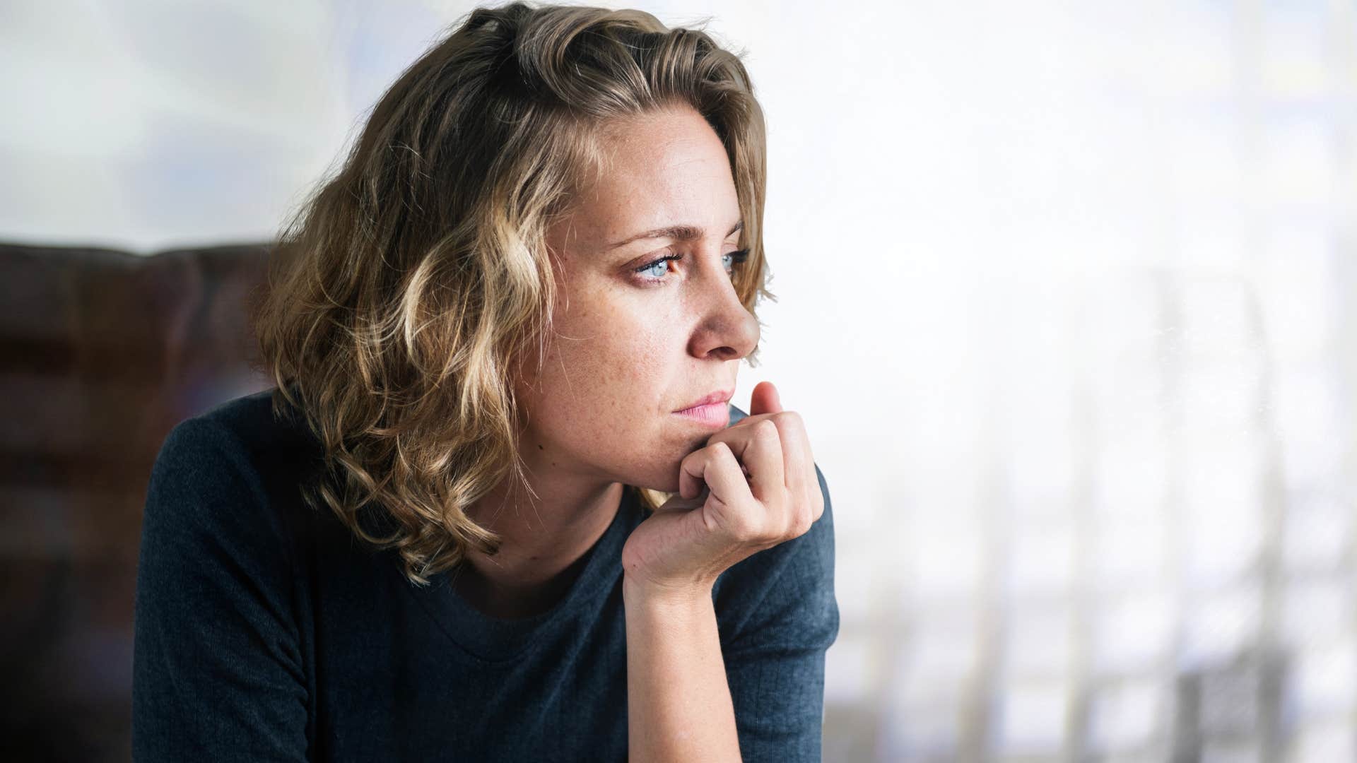 sad woman at home alone because nobody checks on her