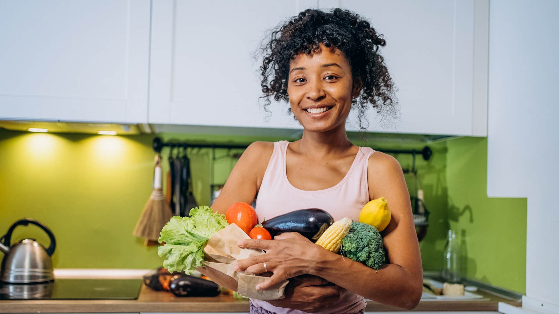 Happy person with healthy vegetables showing they are worth it post-divorce
