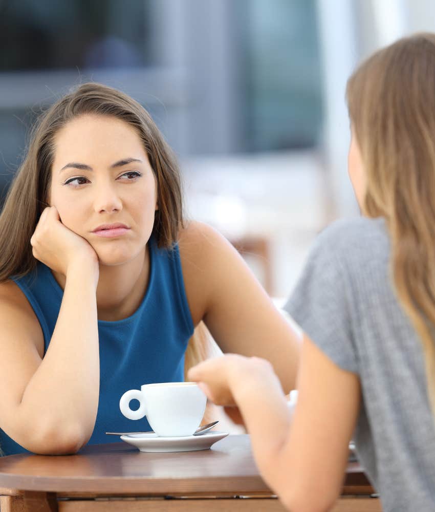 Envious friend smirks showing they aren't on your side