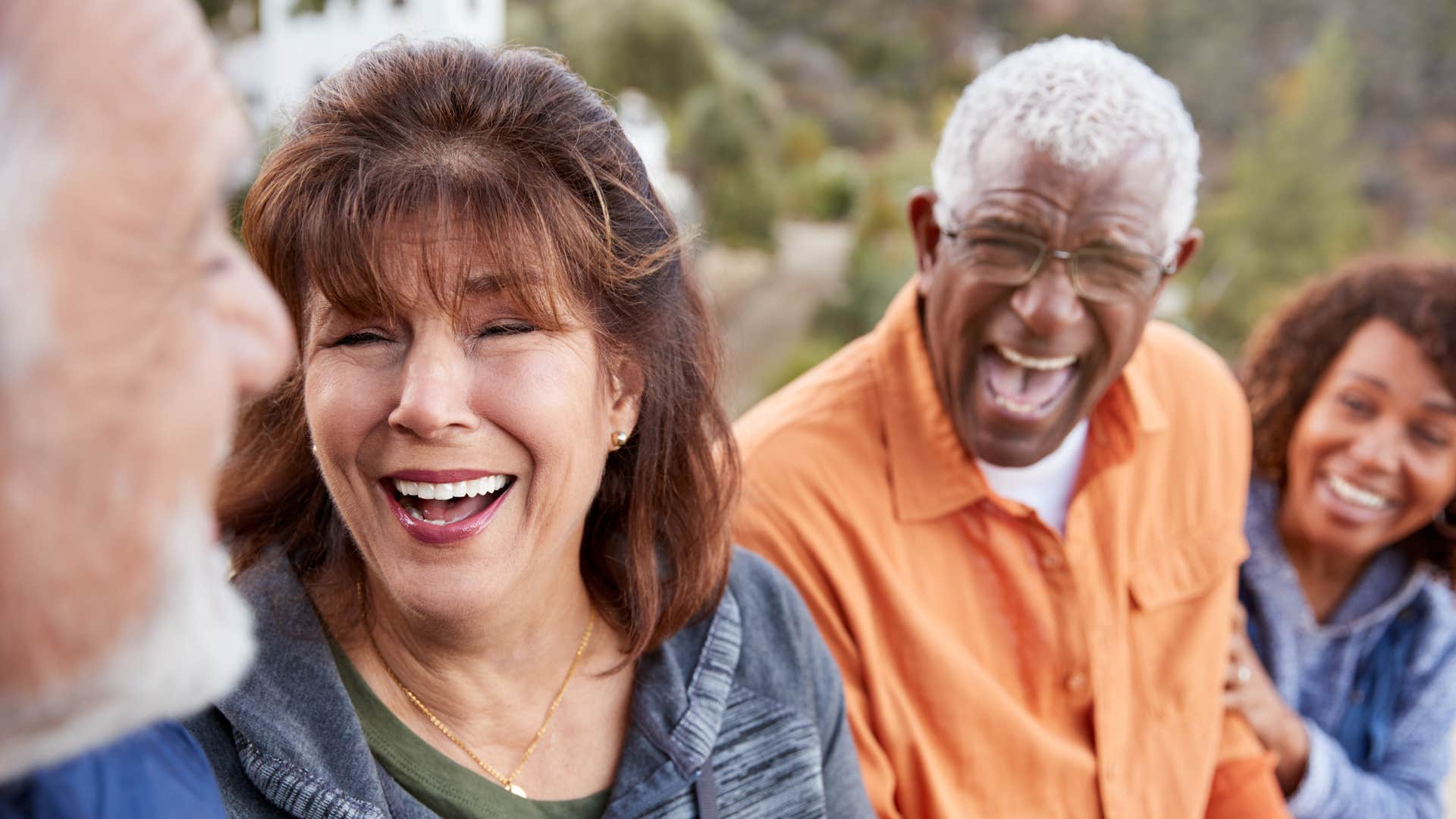 Excited friends laugh showing gratitude is way to happiness