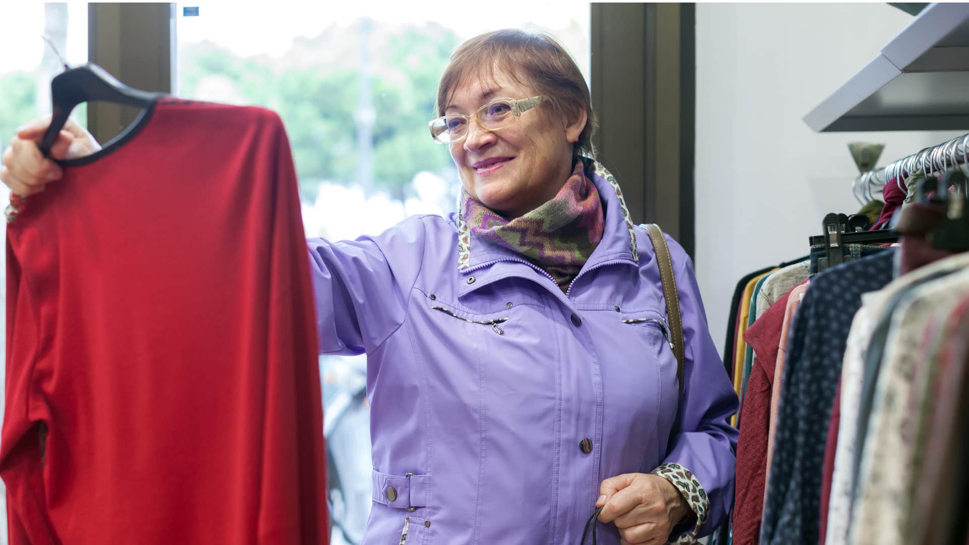 boomer woman shopping for new clothes at a store