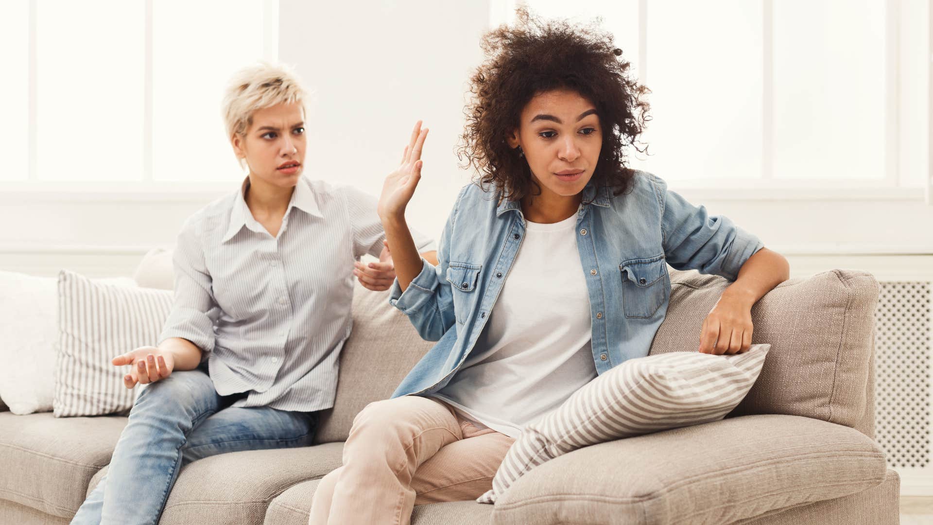 Fed up person puts up hand showing lost trust in friend