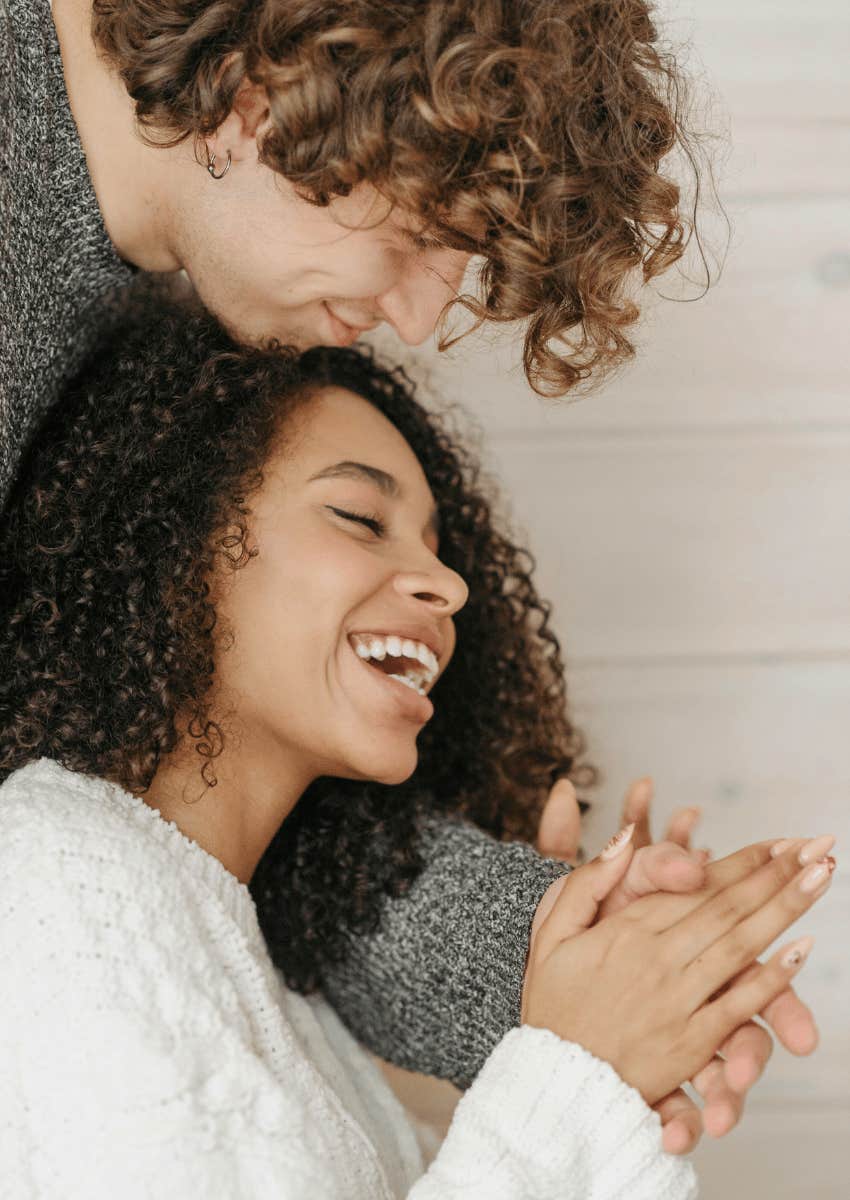 smiling couples hugging each other close