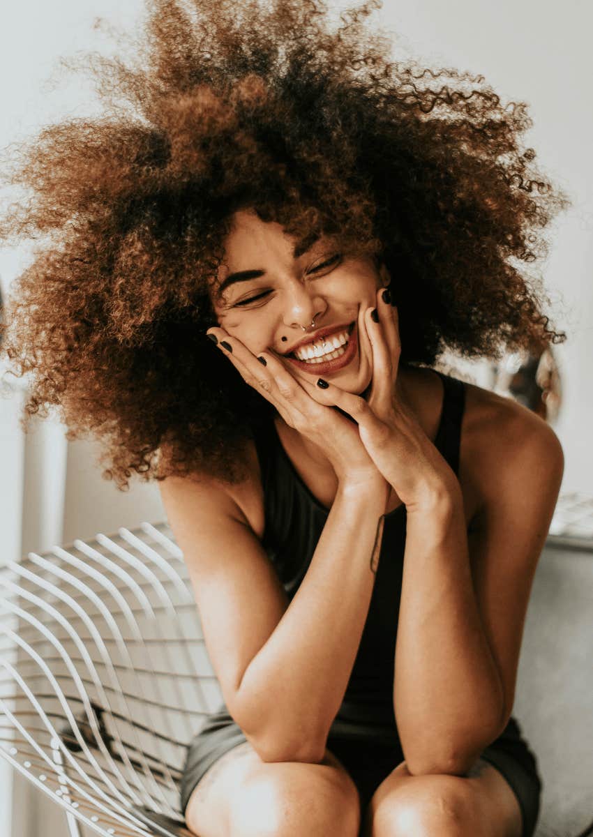smiling woman with curly hair