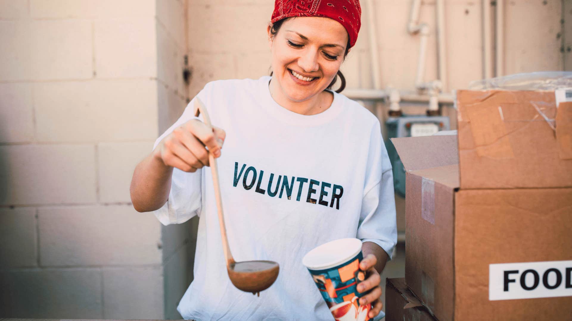 smiling woman volunteering giving back to her community