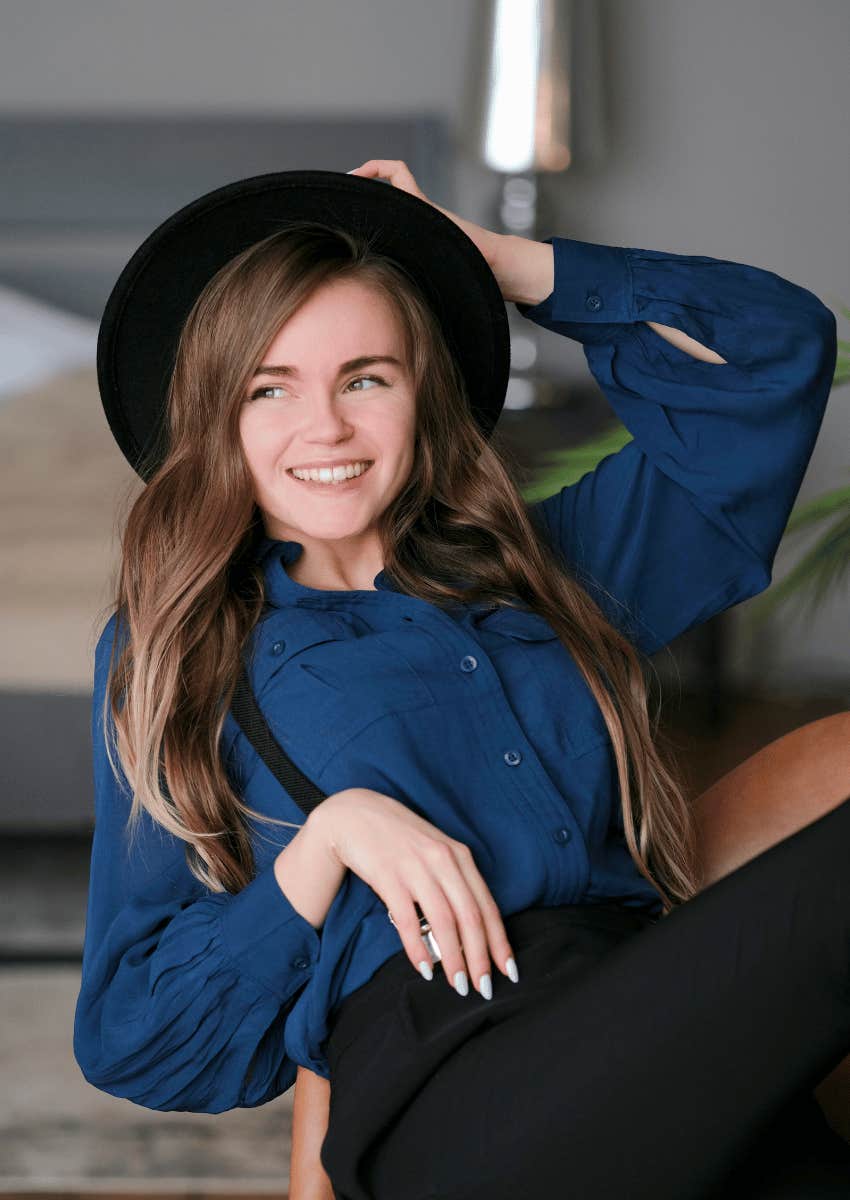 smiling young woman leaning back on chair