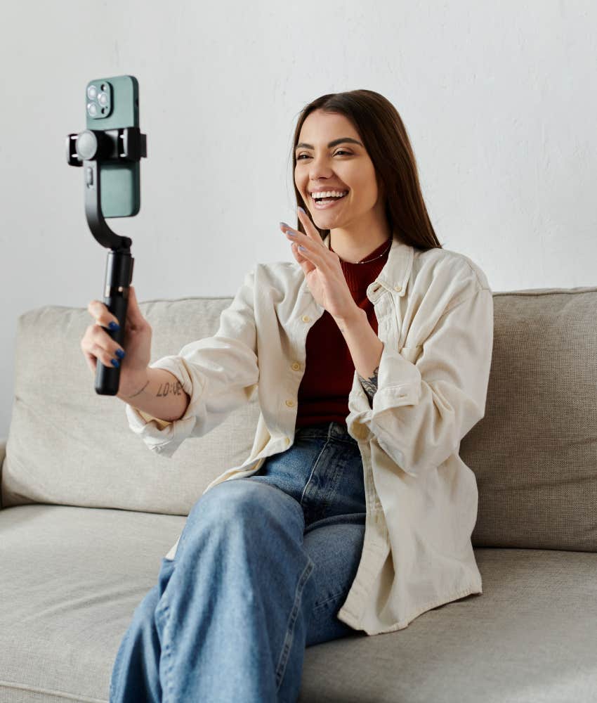 heartbroken woman taking videos for social media