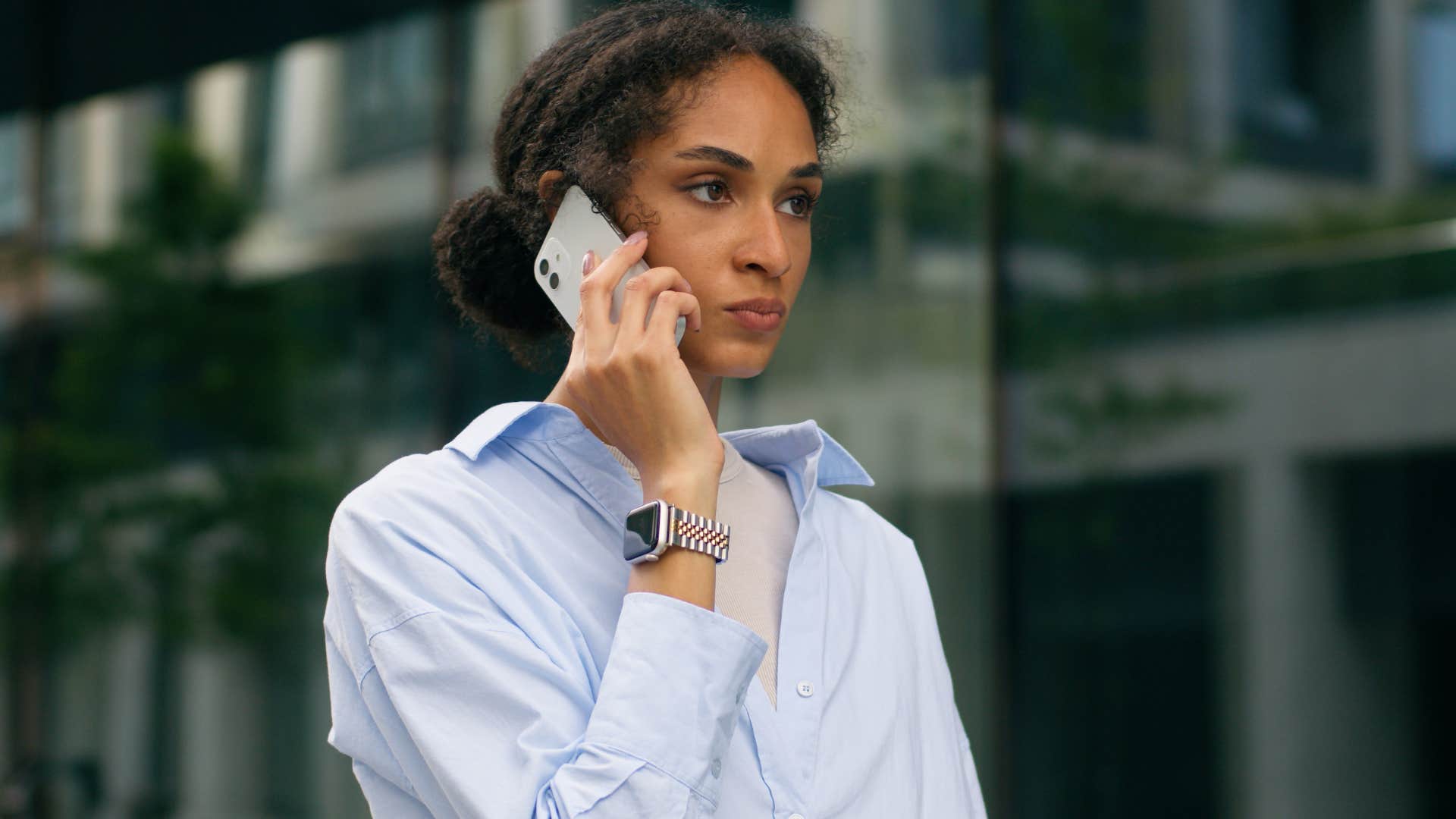 goal-focused woman walking seriously outside