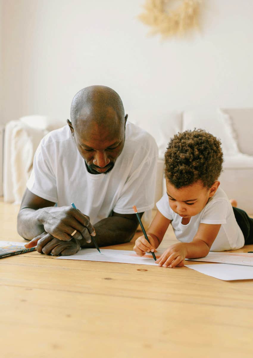 stay at home dad coloring with his child
