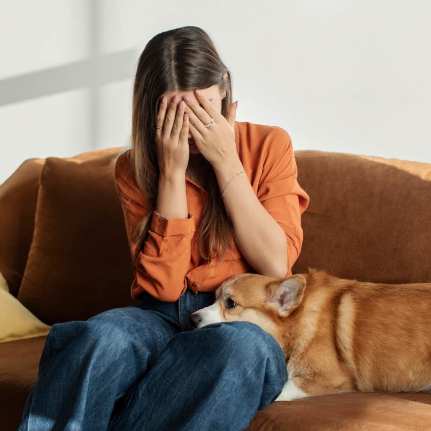 grieving woman being comforted by her soul pet