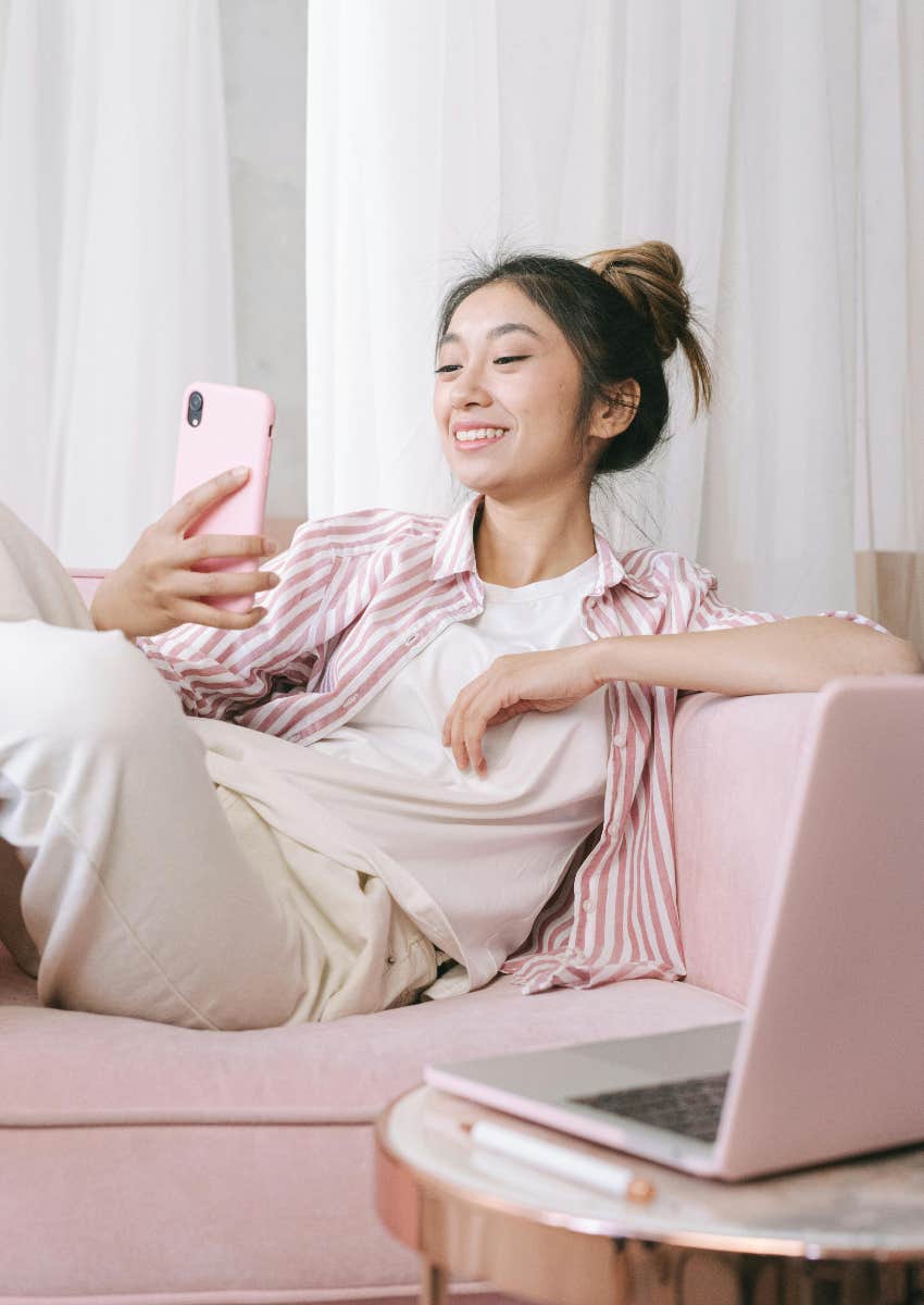 gen z woman on her phone using social media