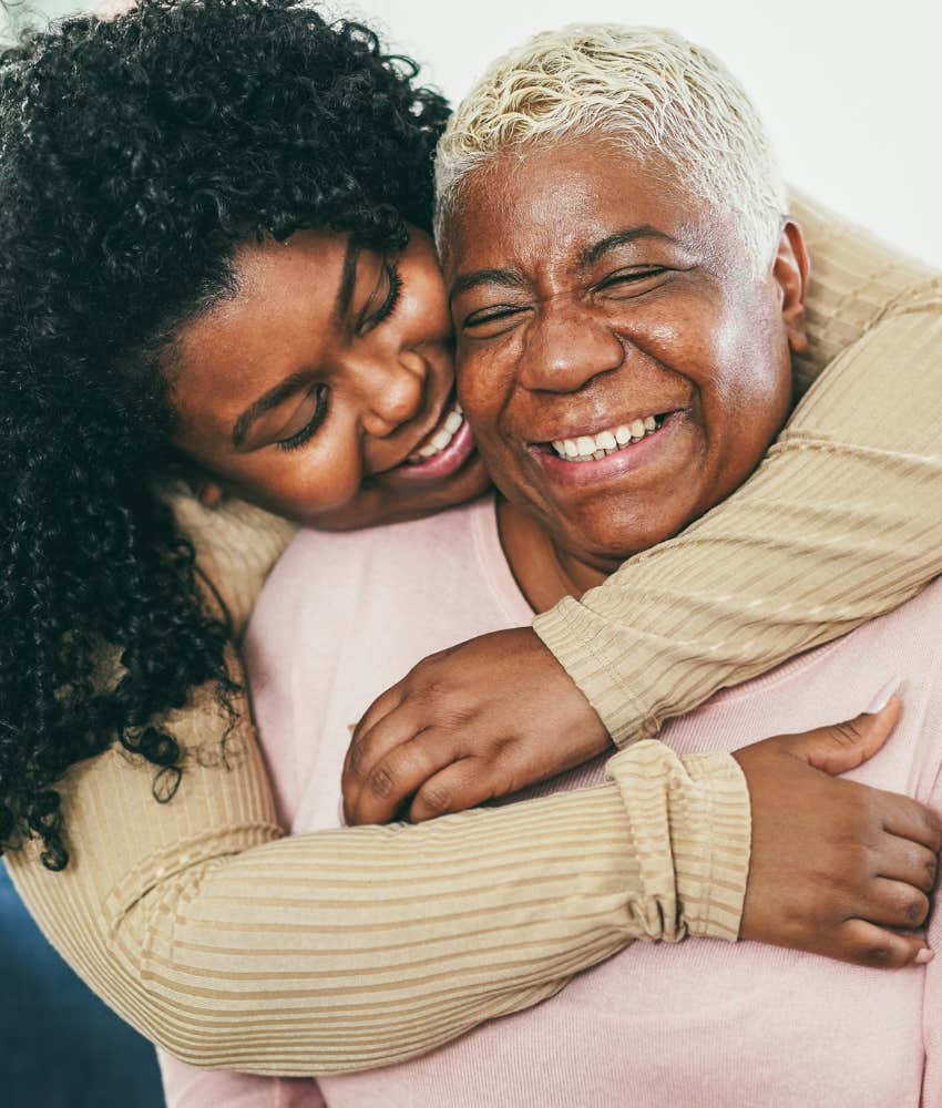 Caring woman hugs elder parent showing perspective shift from exhaustion