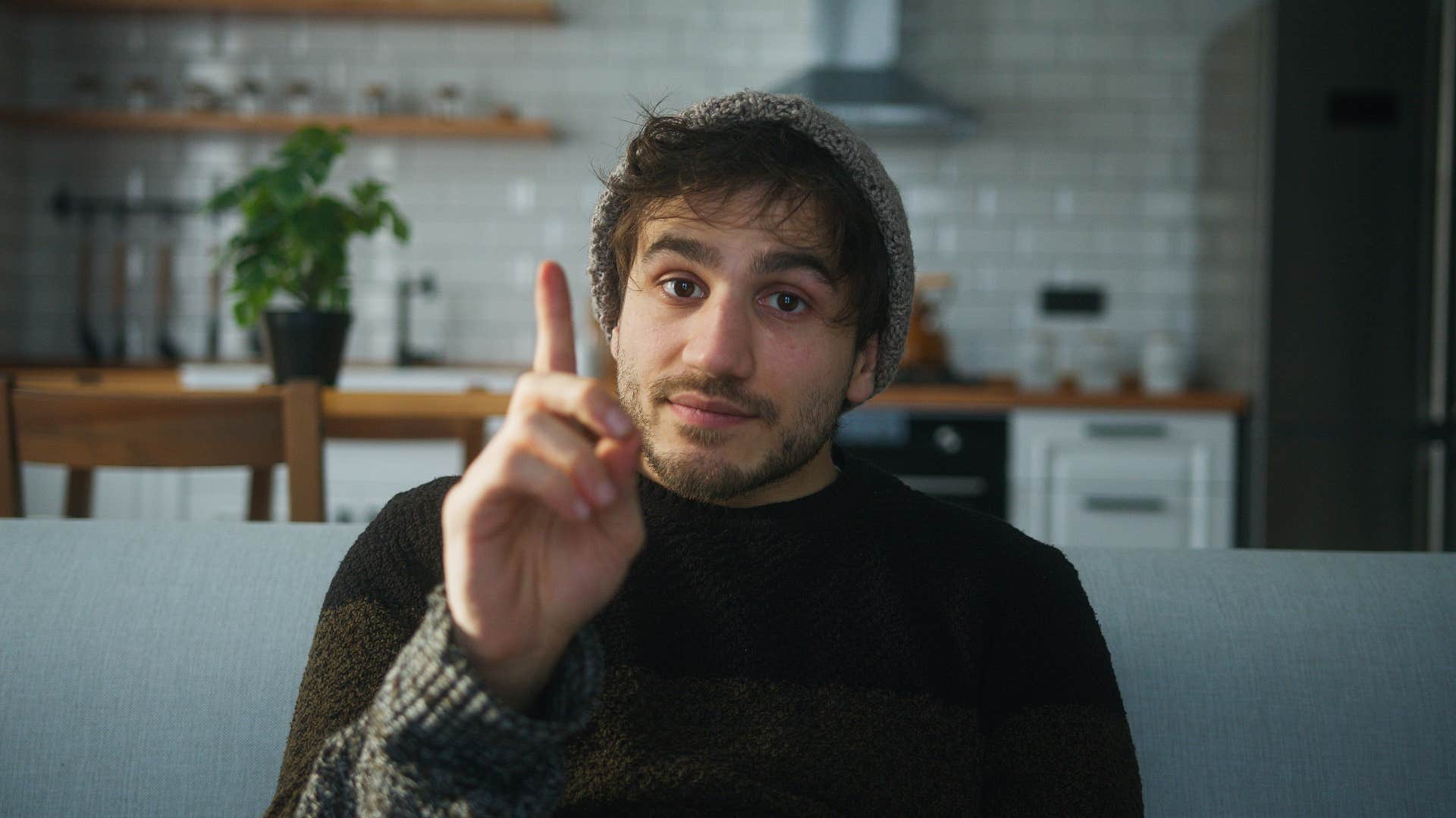 man about to interrupt someone speaking