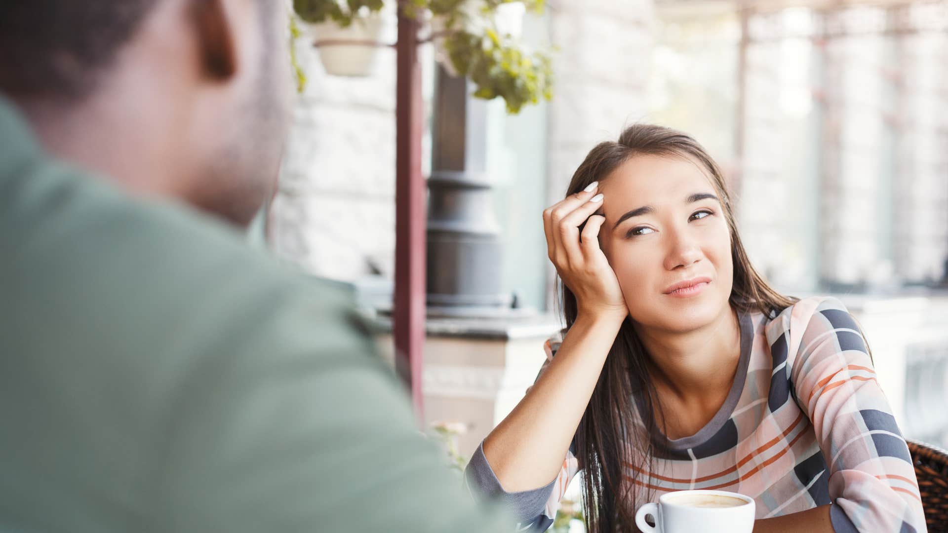 annoyed woman listening to man talk about rules