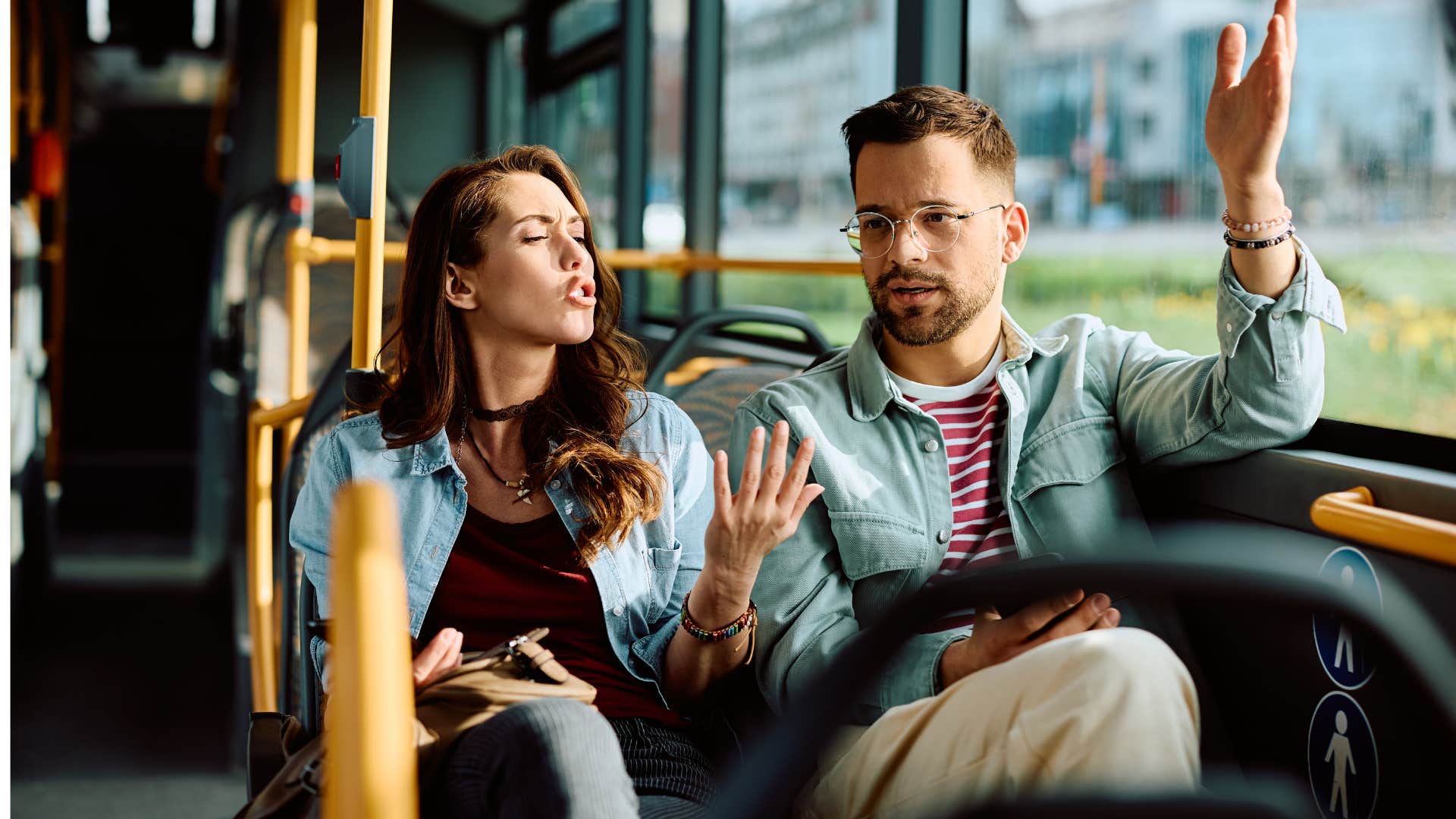 couple arguing on the bus as man says it was just a joke