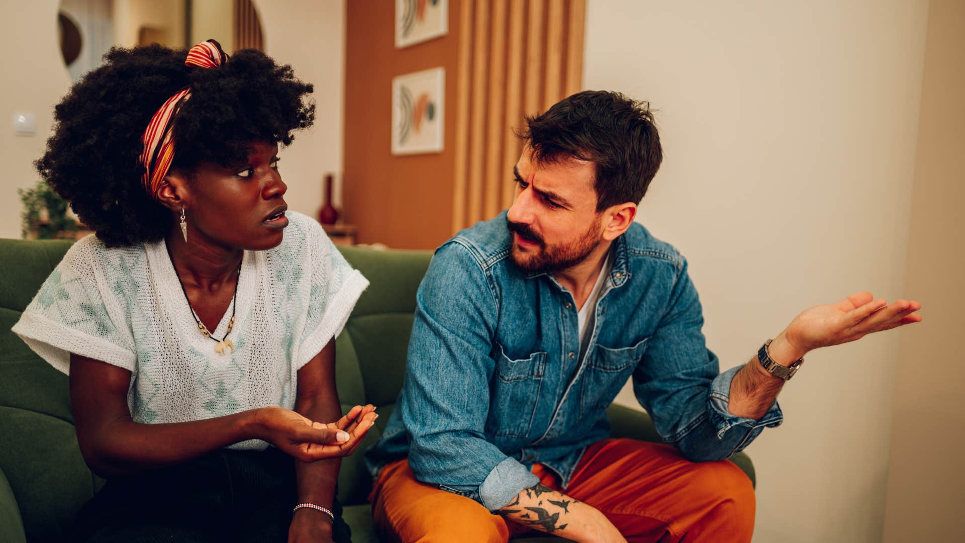 couple arguing as man asks why can' you let it go