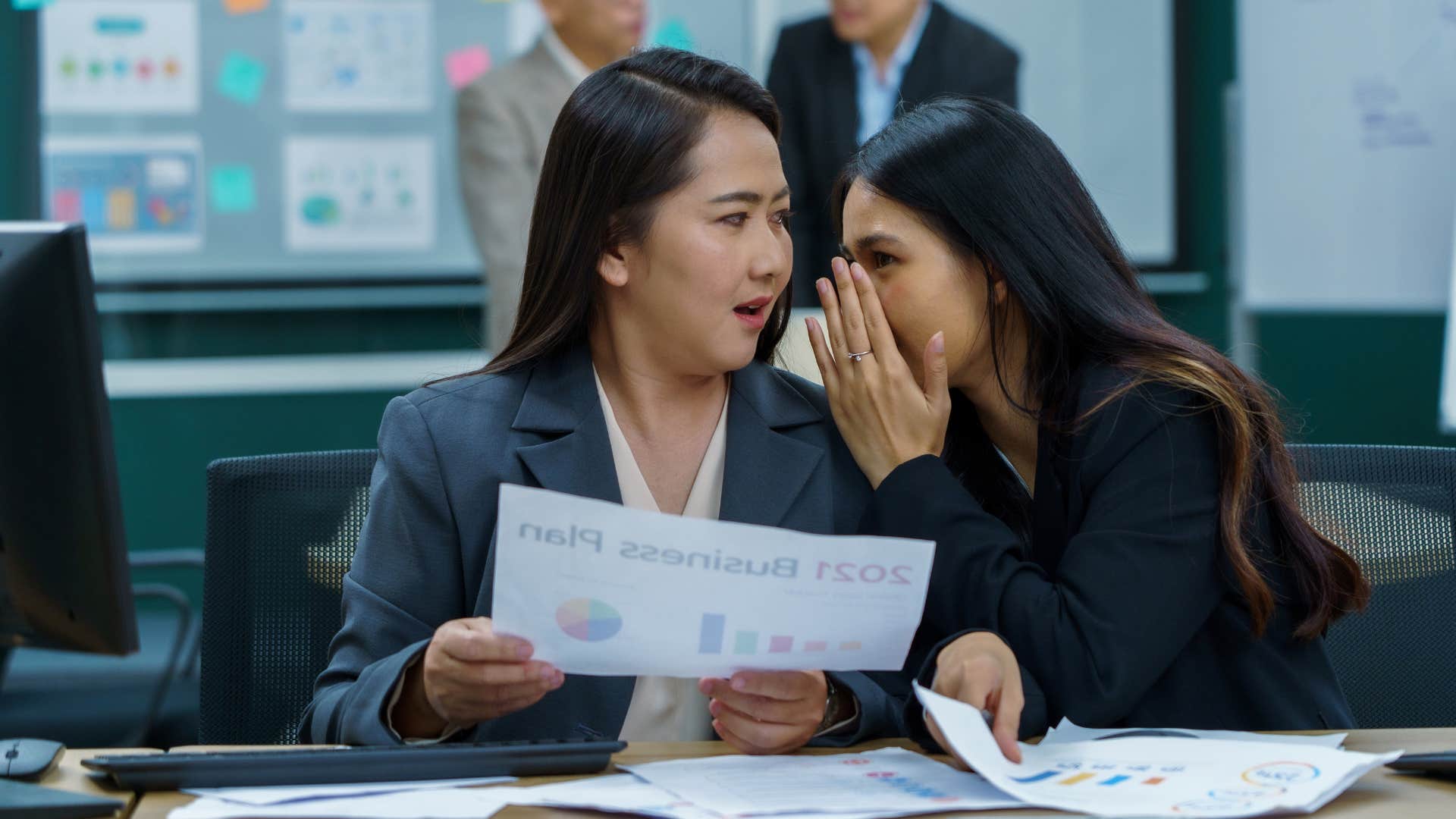 co-workers gossiping and mocking others