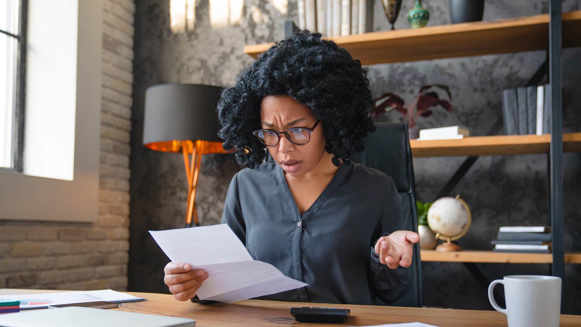 employee opening mail to discover paycheck isn't coming