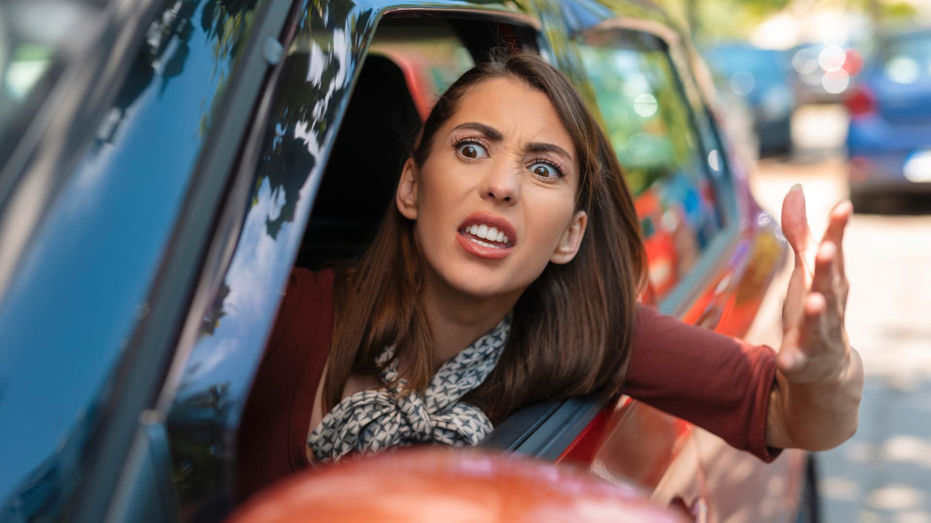 woman in red cart honking at inconsiderate people as she yells out window