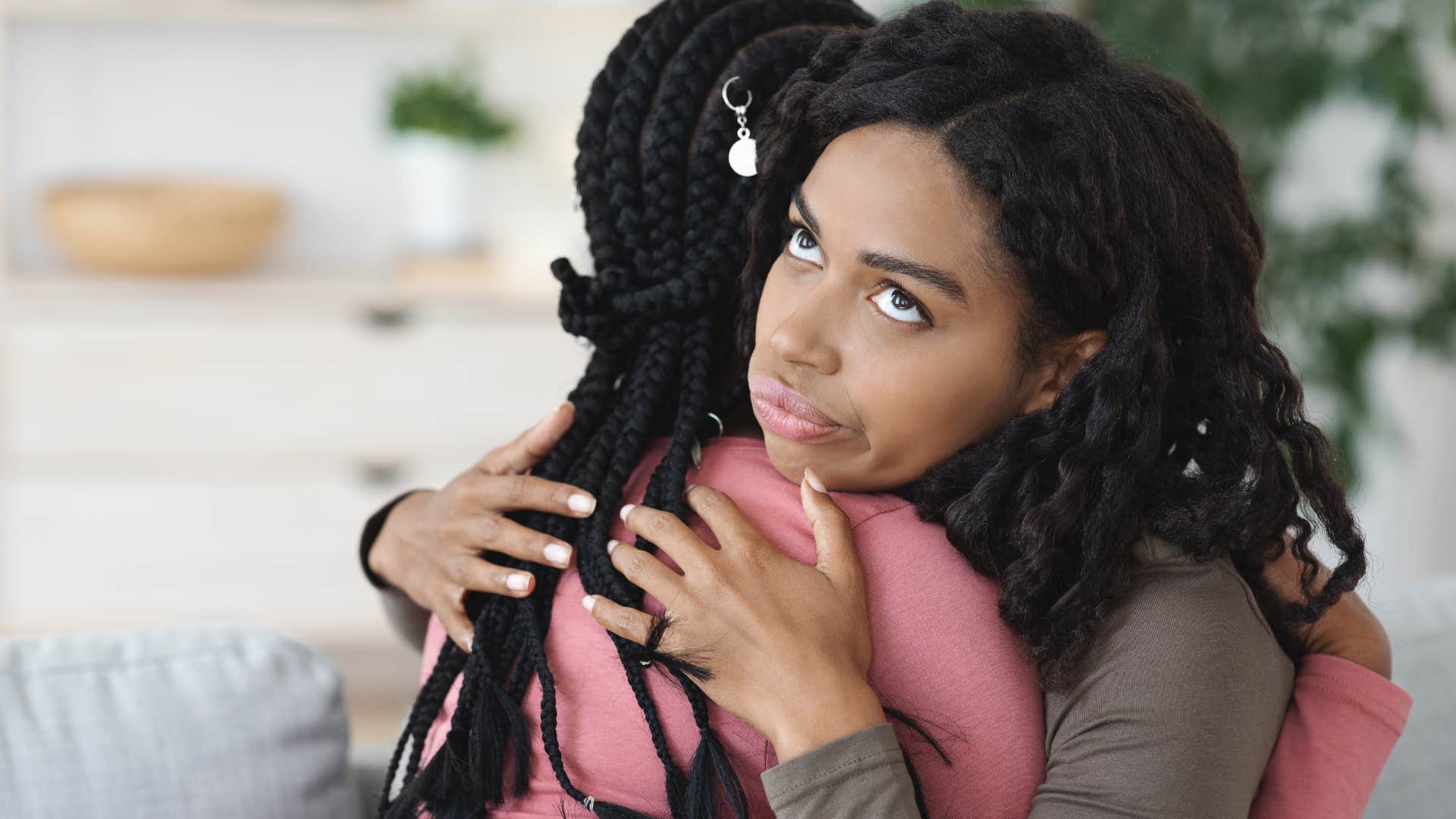 woman being performative with empathy hugging friend