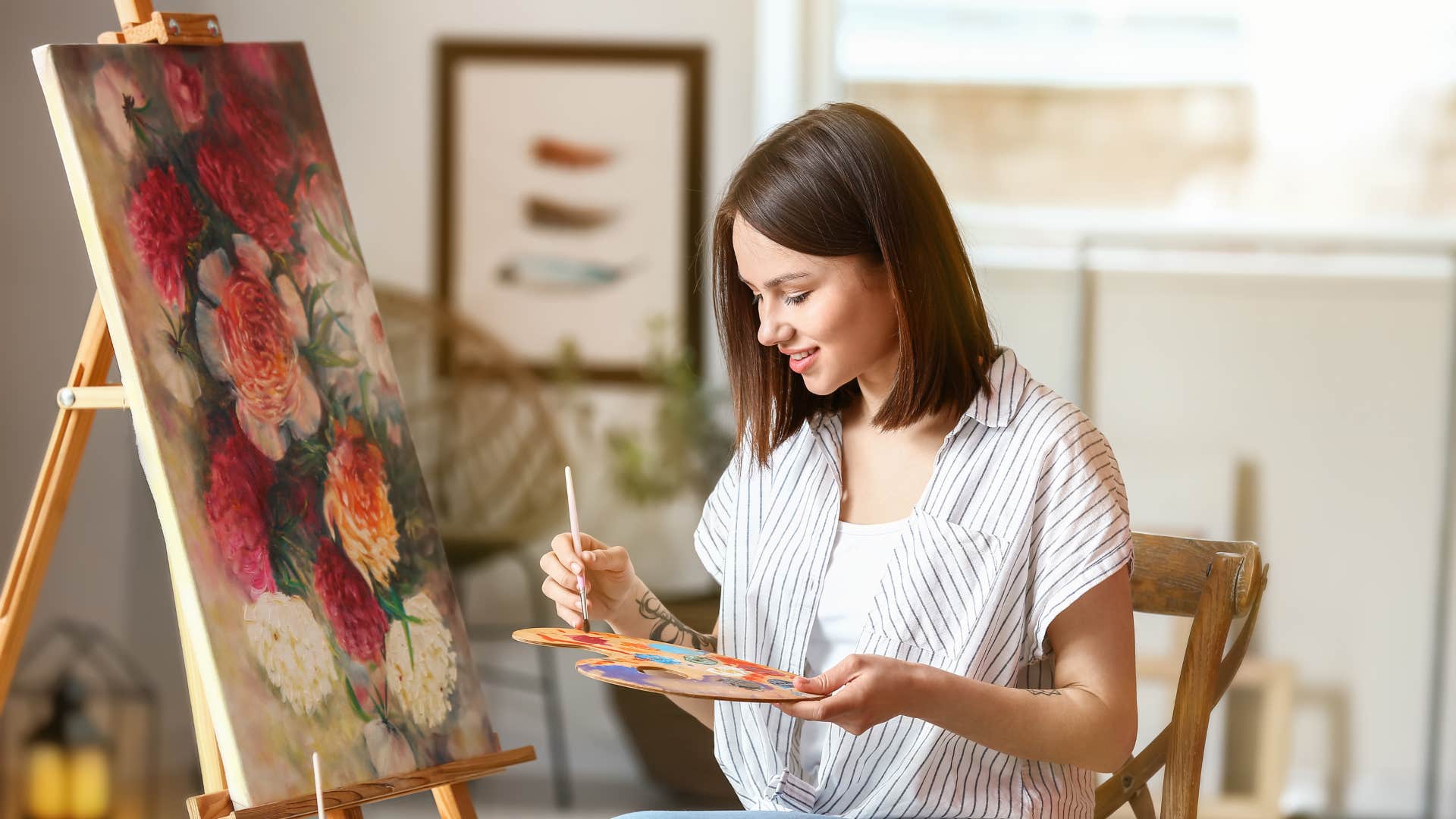 woman painting as she does something outside of her usual routine