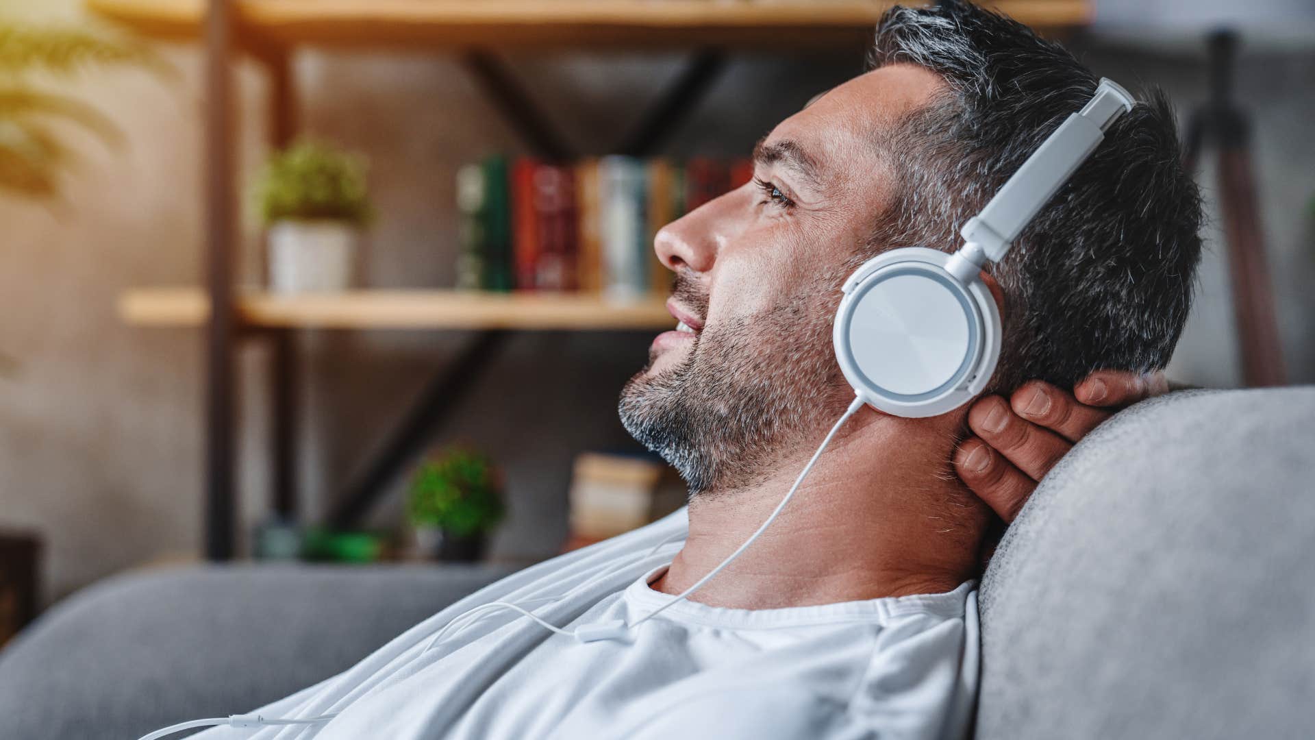 man in gray shirt listening to ambient music instead of regular music