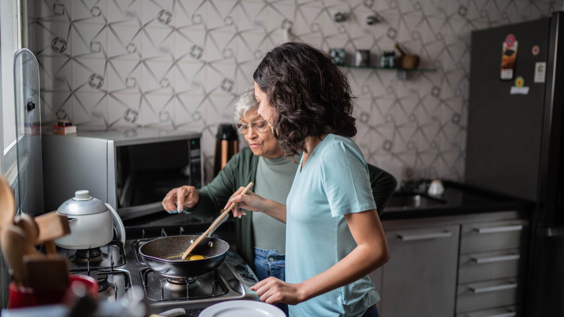 frugal women having fun cooking at home