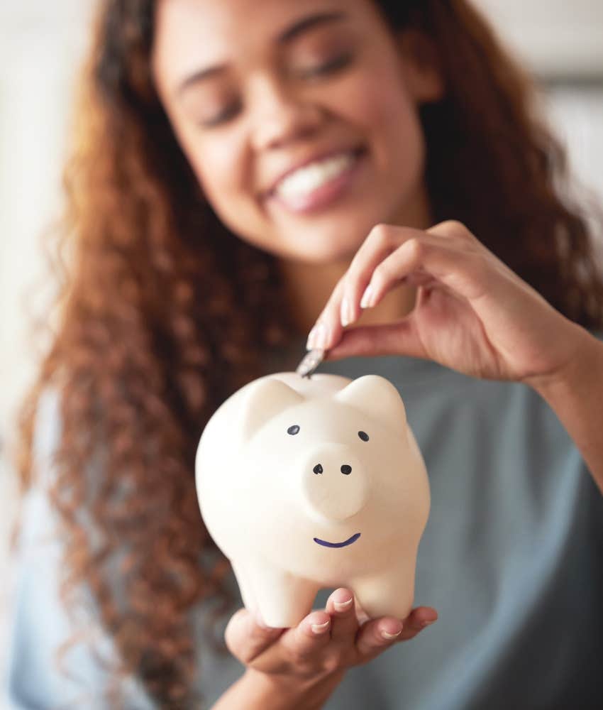 Grateful person puts coin in piggy bank showing security for future