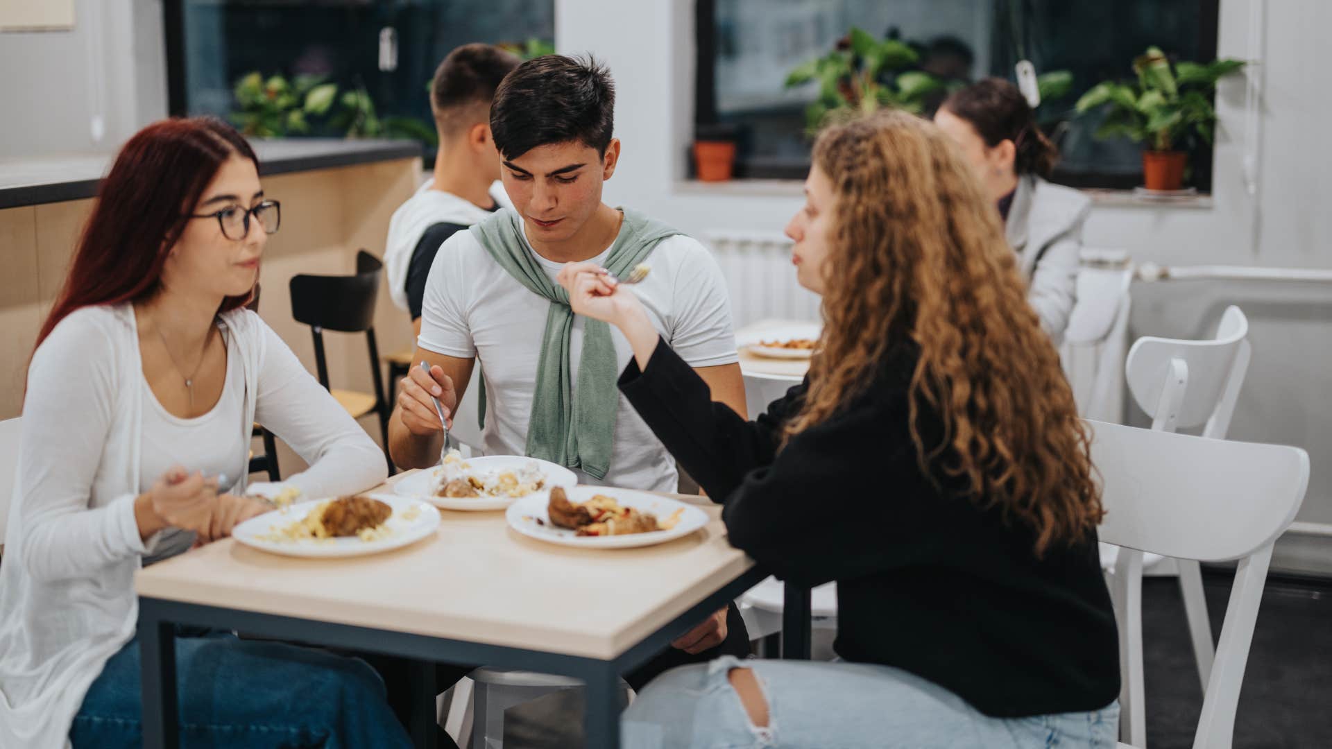 friends eating together in cafeteria
