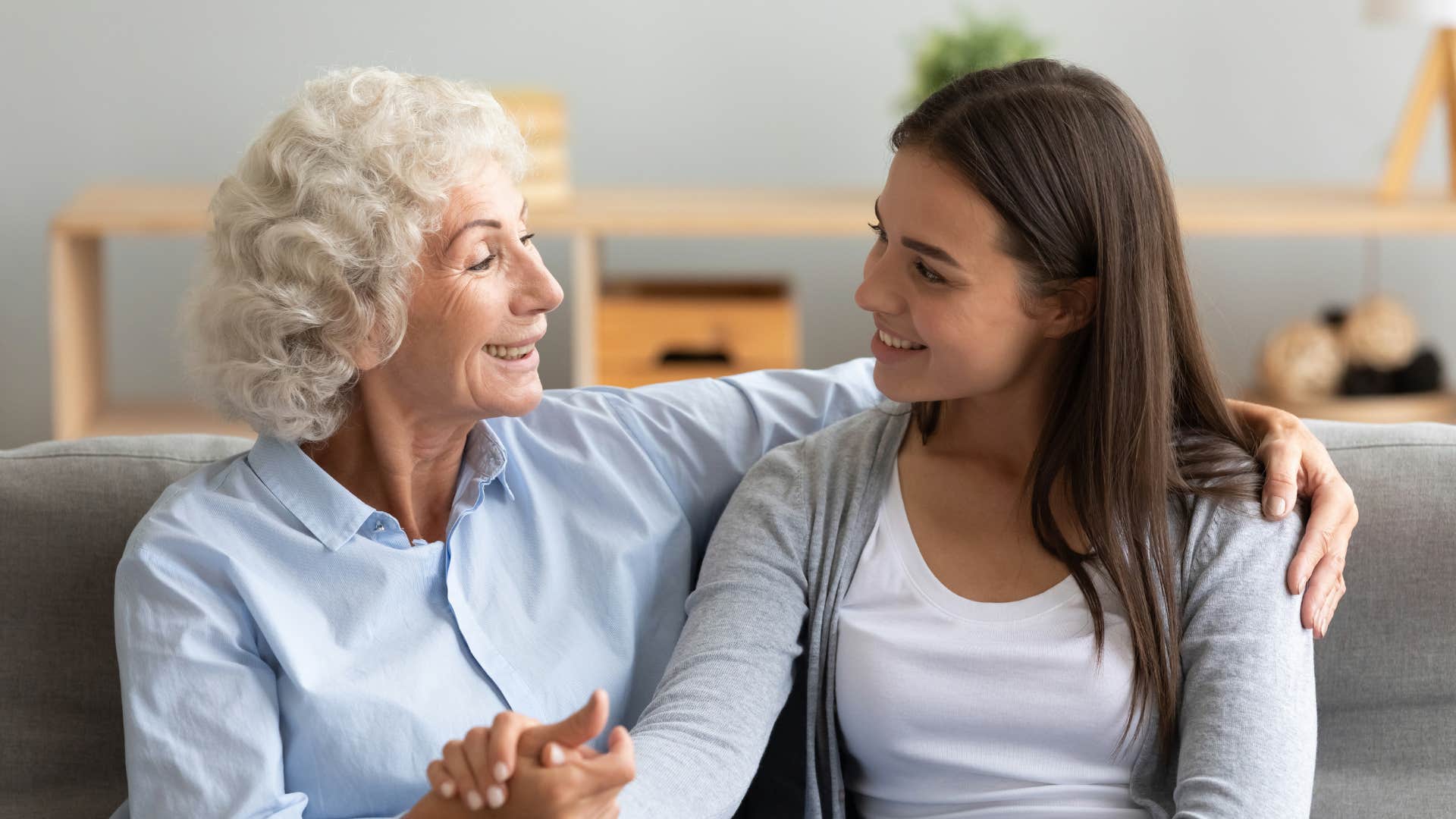 older woman talking to young woman about traditional norms