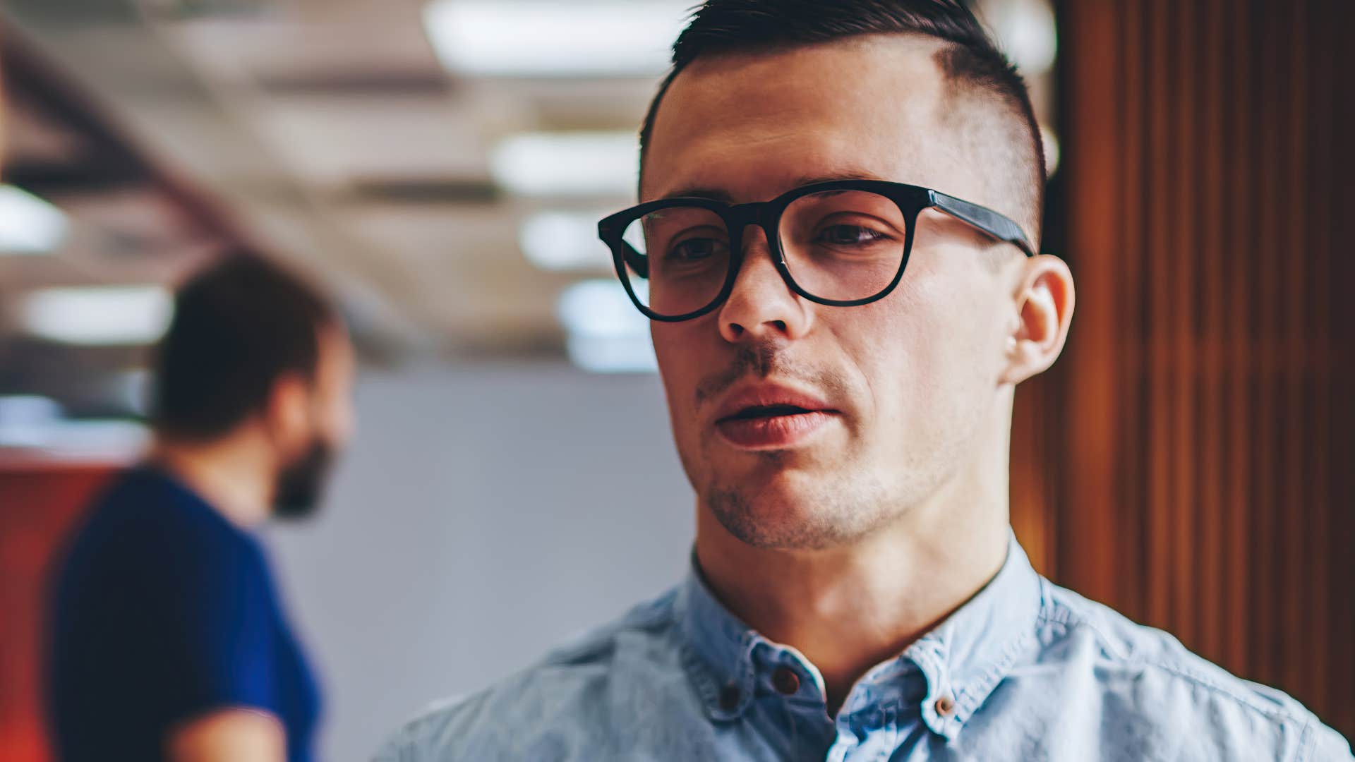 Man offering excuses for misbehavior for men at work.