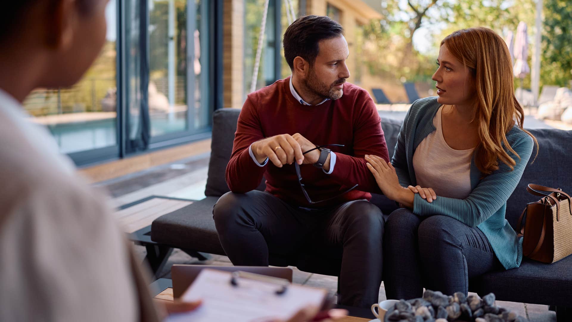 Woman making assumptions about gender roles with a couple.