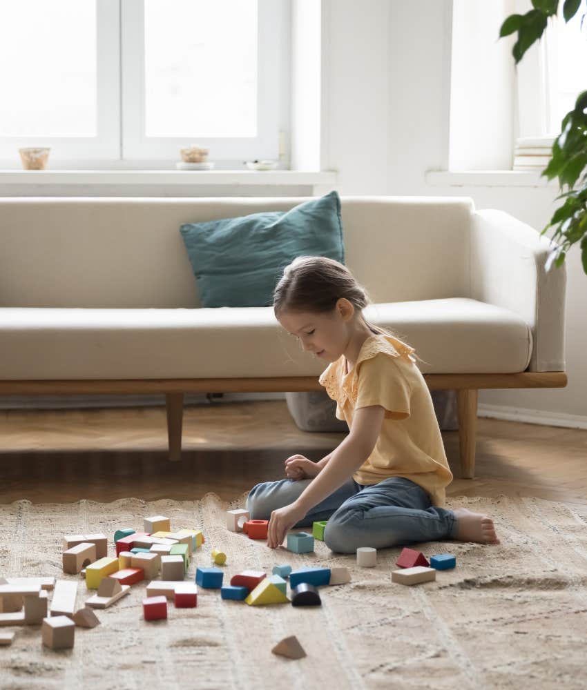 intelligent child plays alone showing it's no big deal