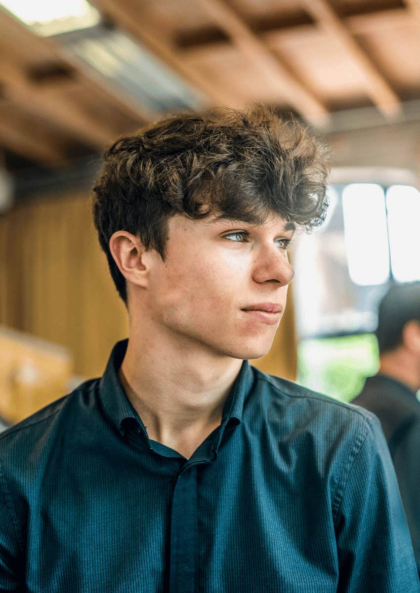 thoughtful young man looking away