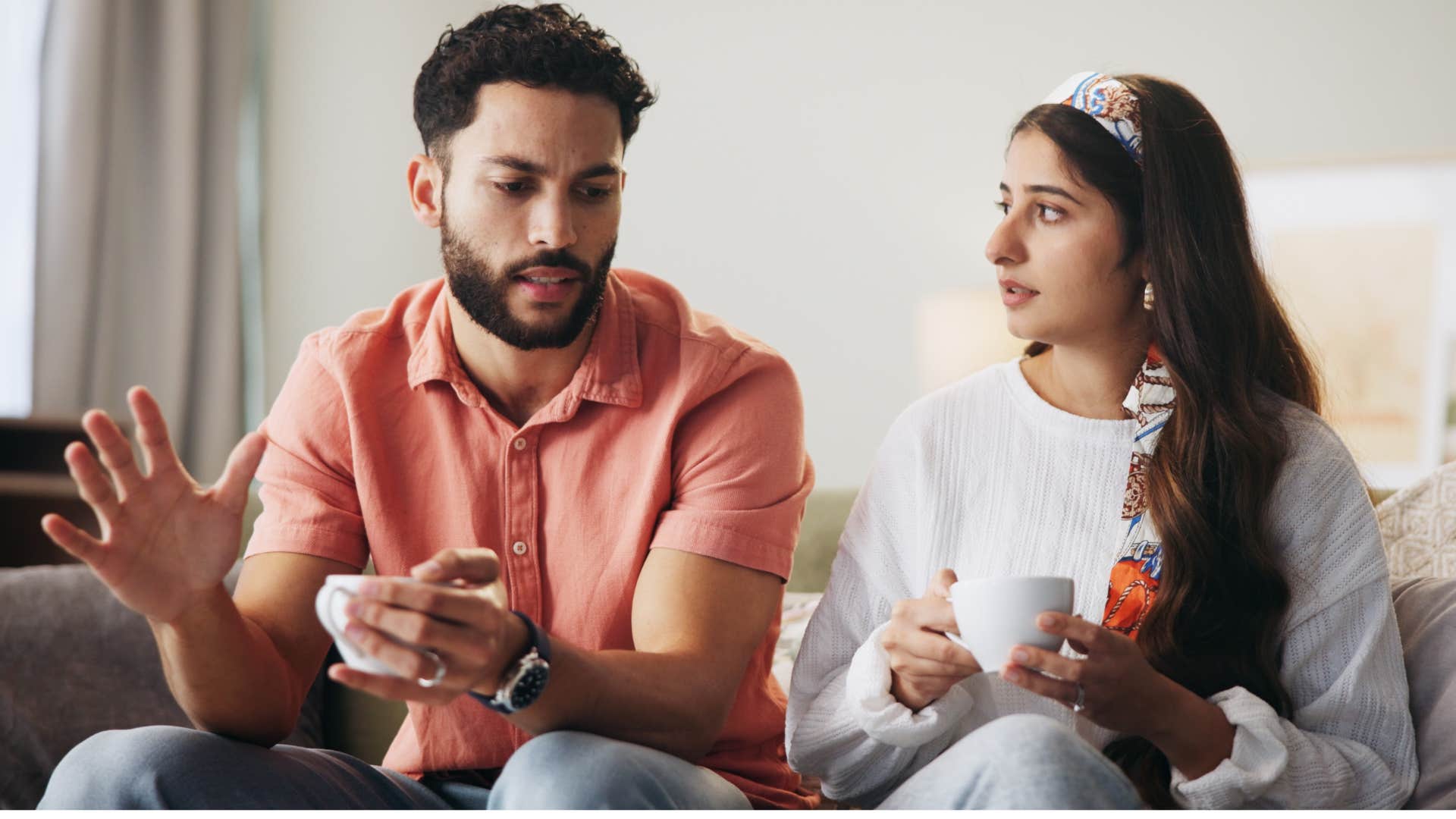 woman sitting with a man who dismisses her feelings