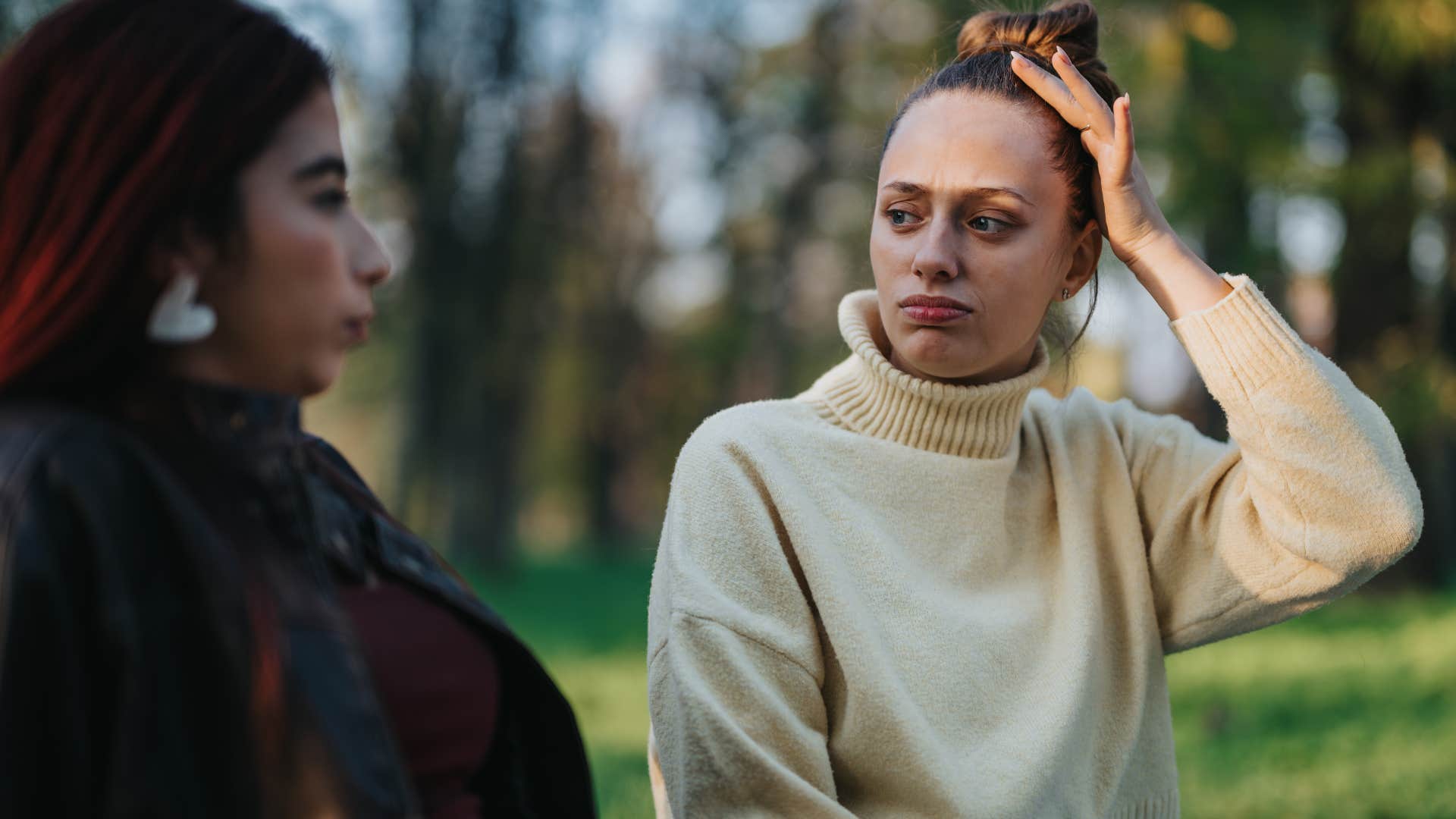 woman who feels guilty setting boundaries sitting with bad friend