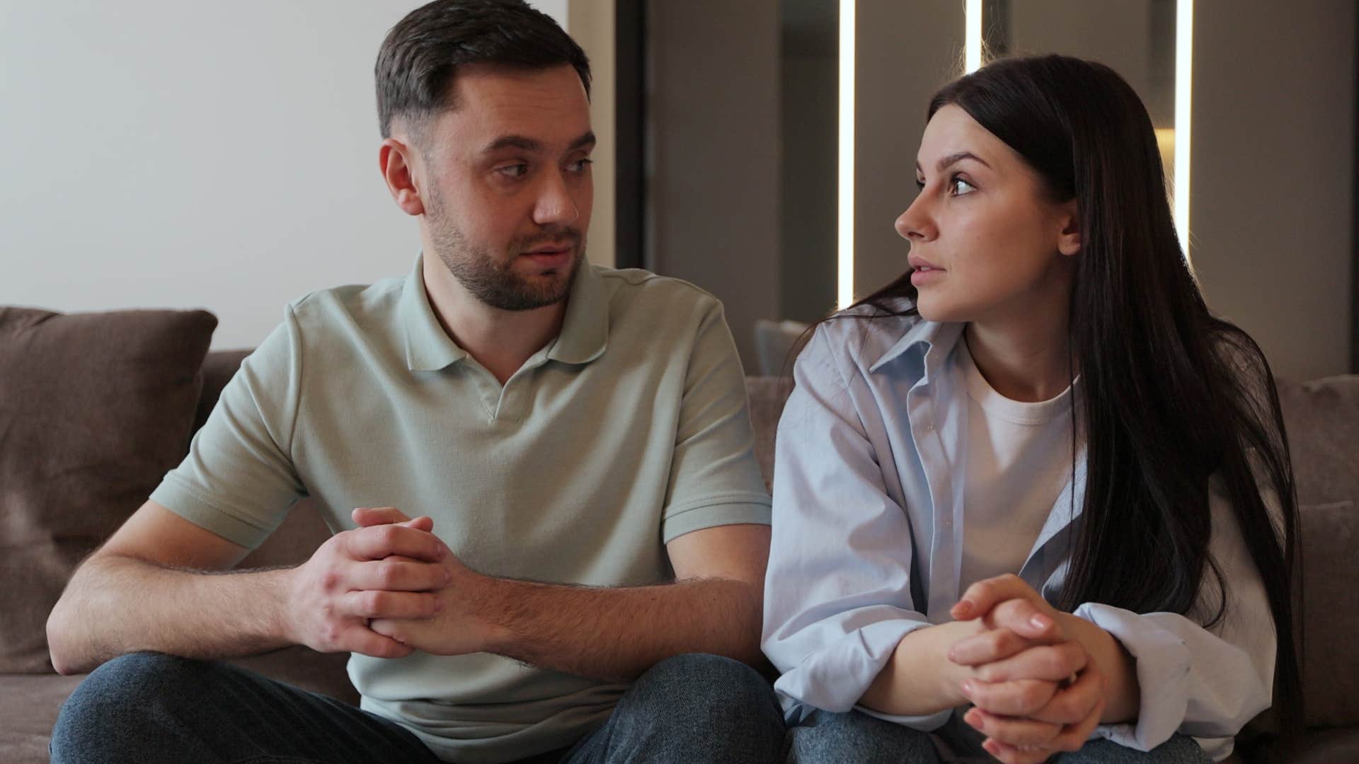 woman sitting with a man whose accomplishments always feel more important