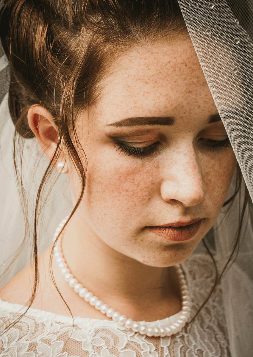 upset bride looking down