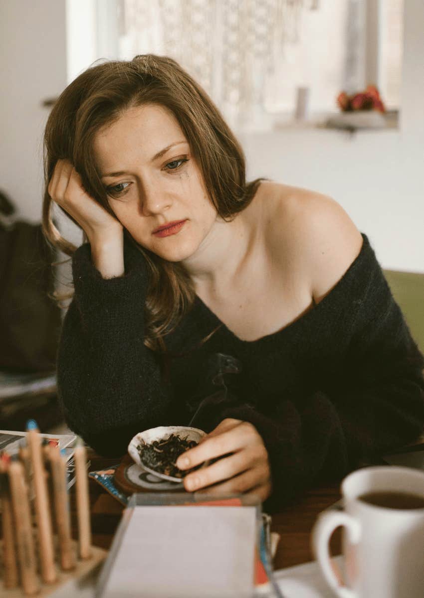 upset older woman sitting alone