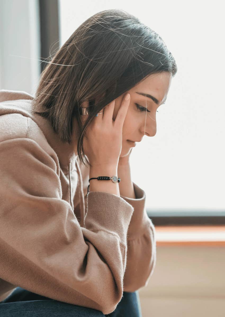 upset woman with her face downturned