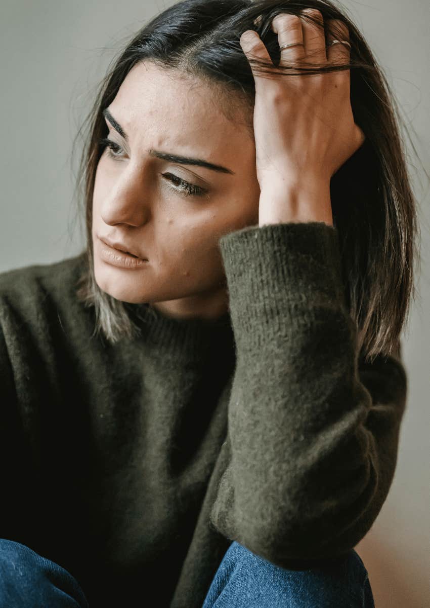 upset woman looking away forlornly