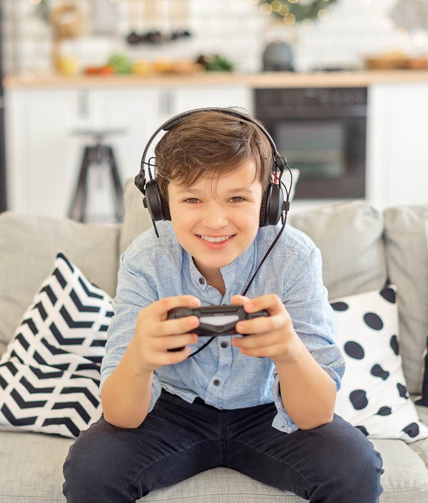 young boy playing video game