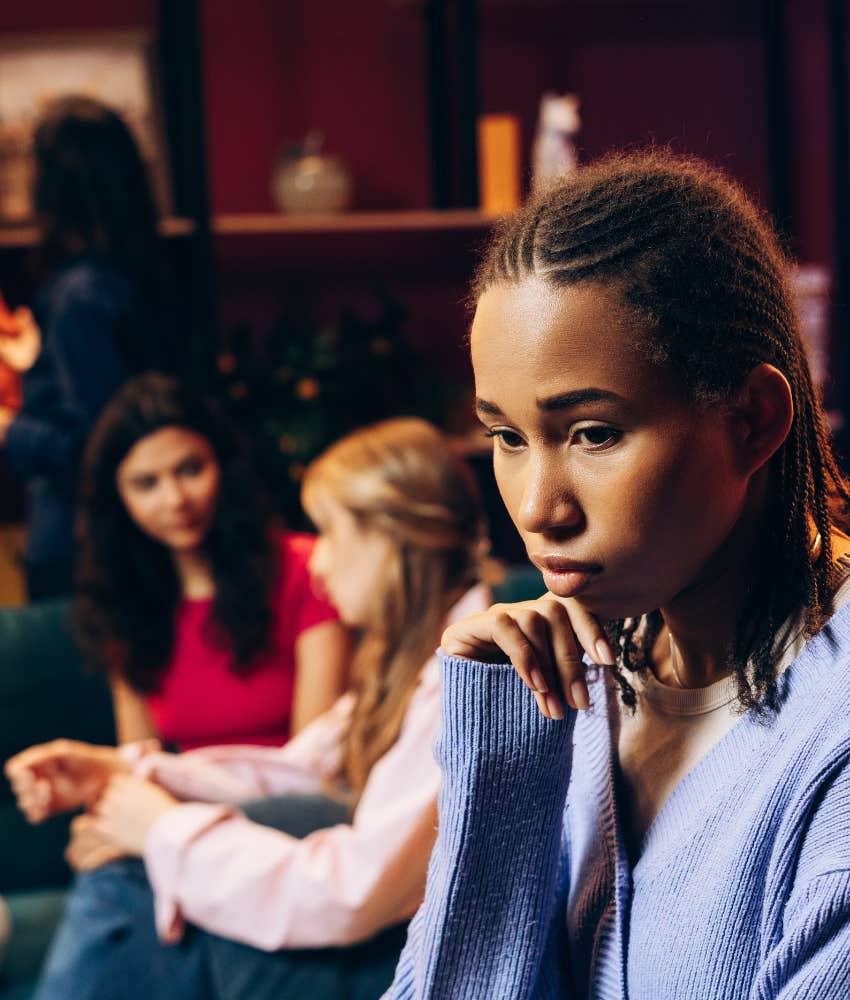 Upset person withdraws from friends showing emotional manipulation