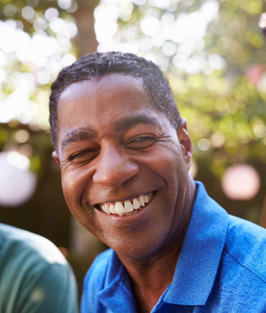 Gen-X man smiles showing he takes care of himself as example for parents 