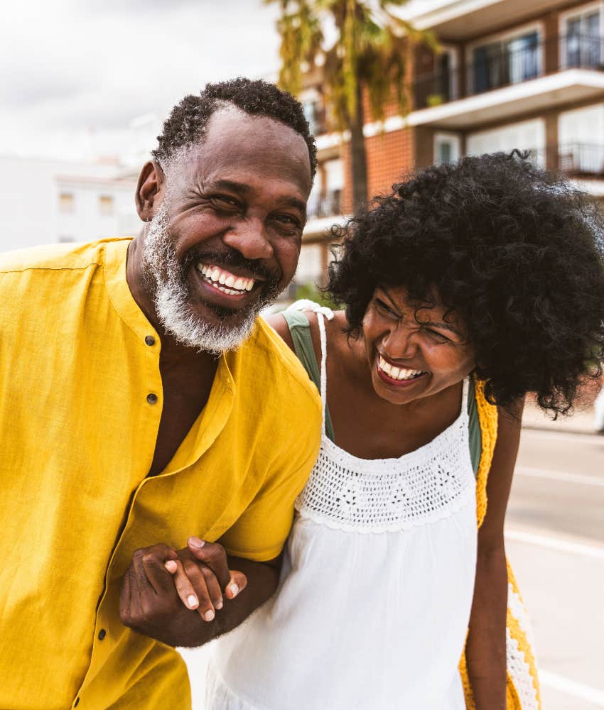 Laughing Gen-X couple showing example for parents to be who you are