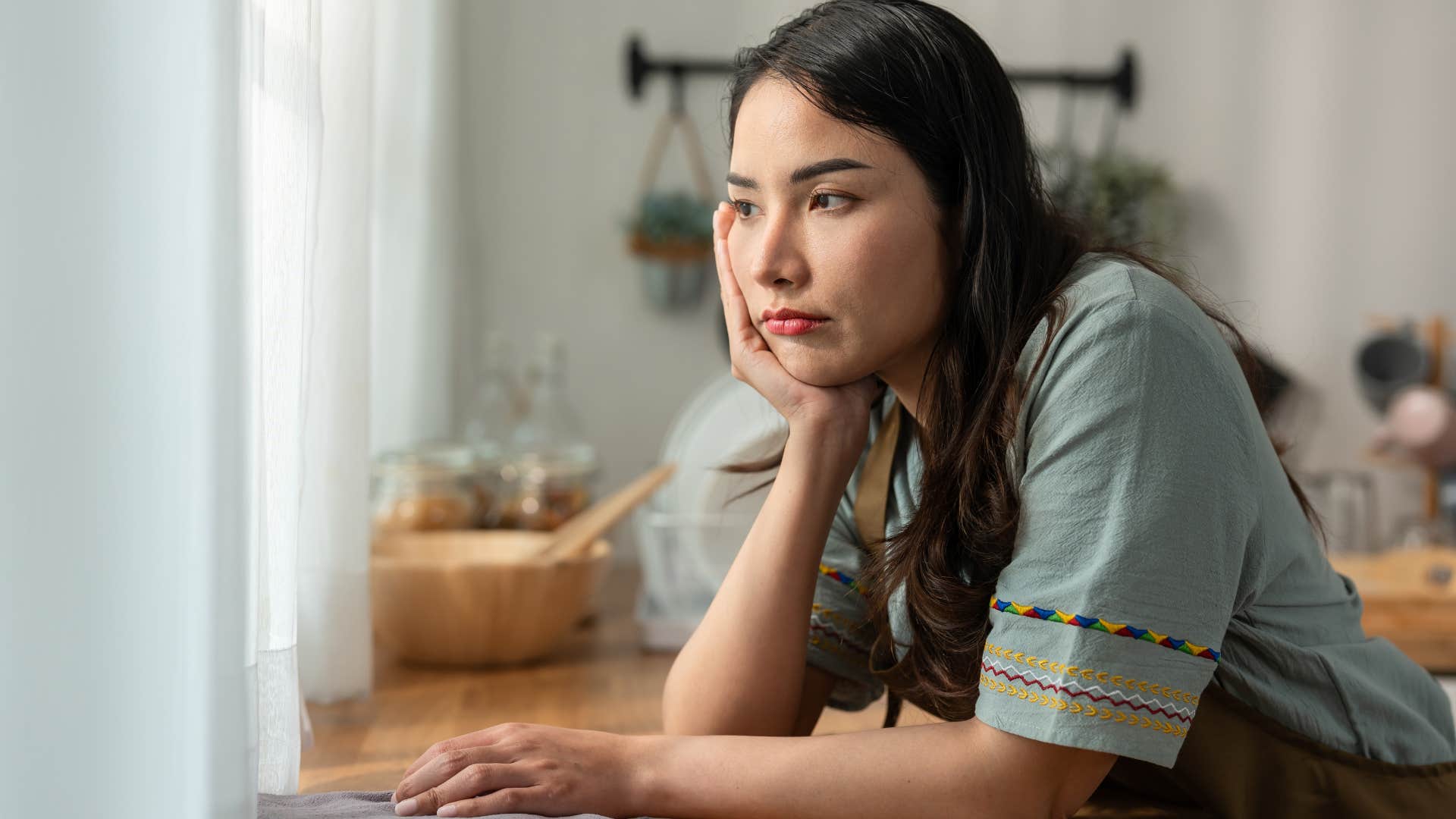 Woman avoiding small acts of kindness while cleaning at home.