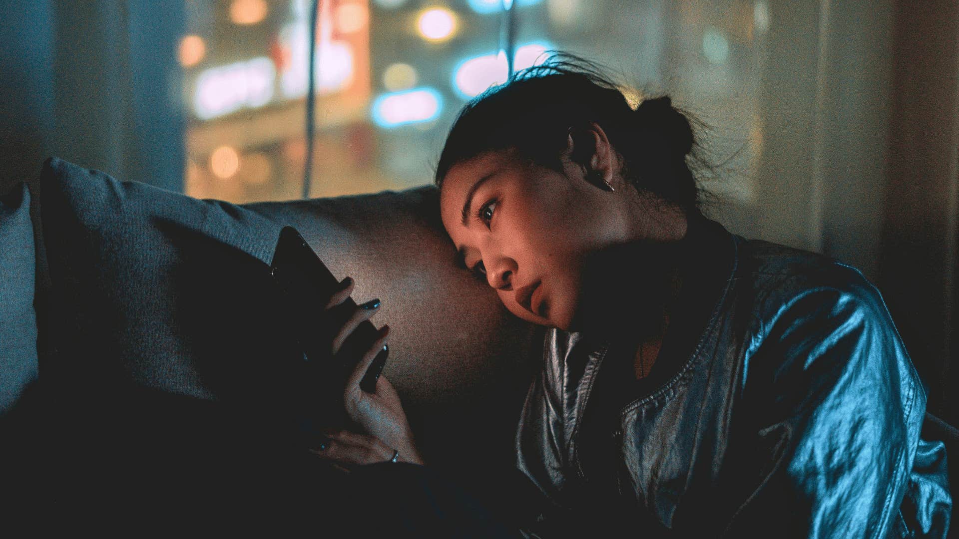 woman constantly checking social media as habit to let go of